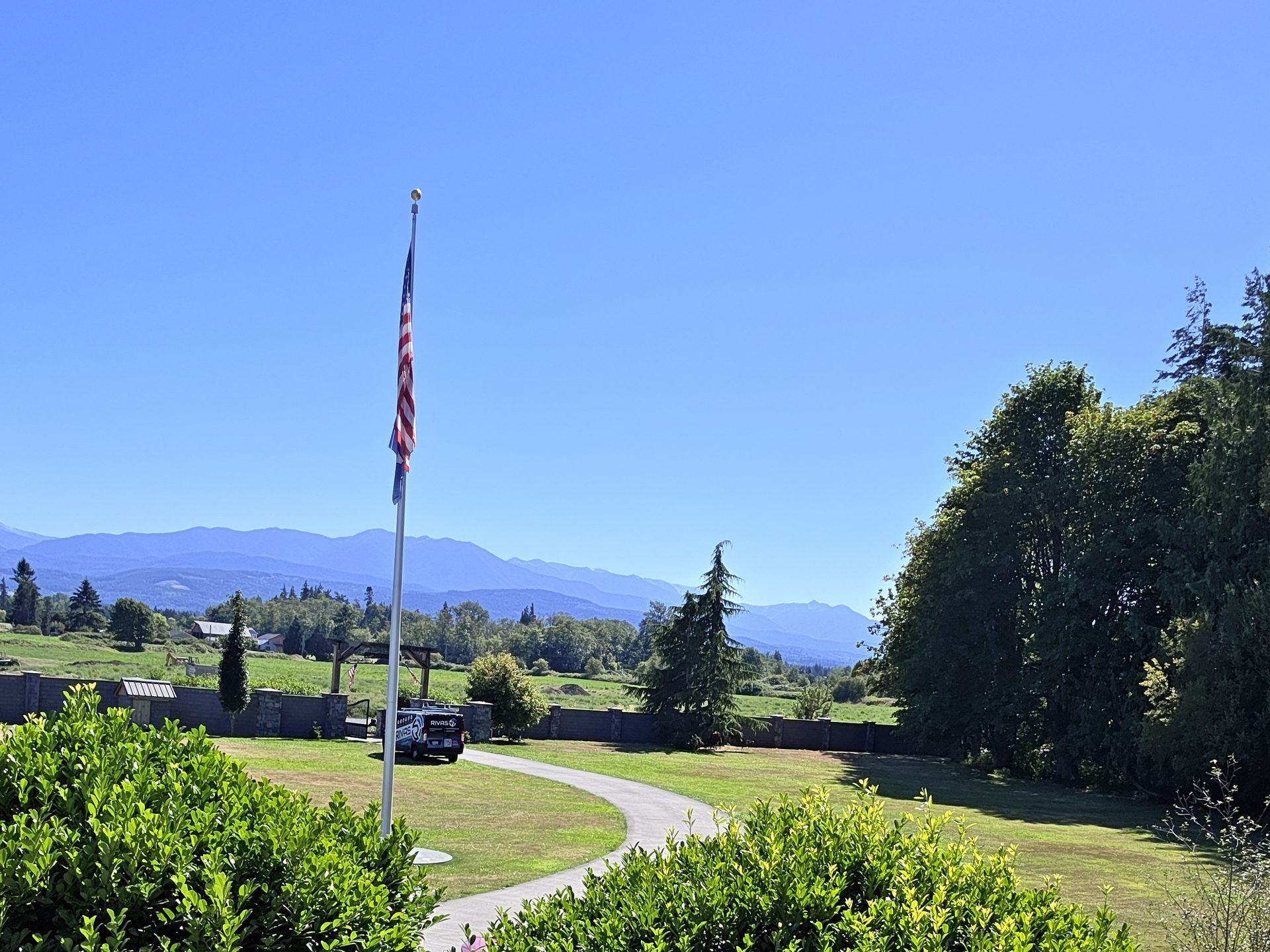 The grounds of a Sequim property covered by outdoor Wi-Fi, with the Olympic Mountains beyond