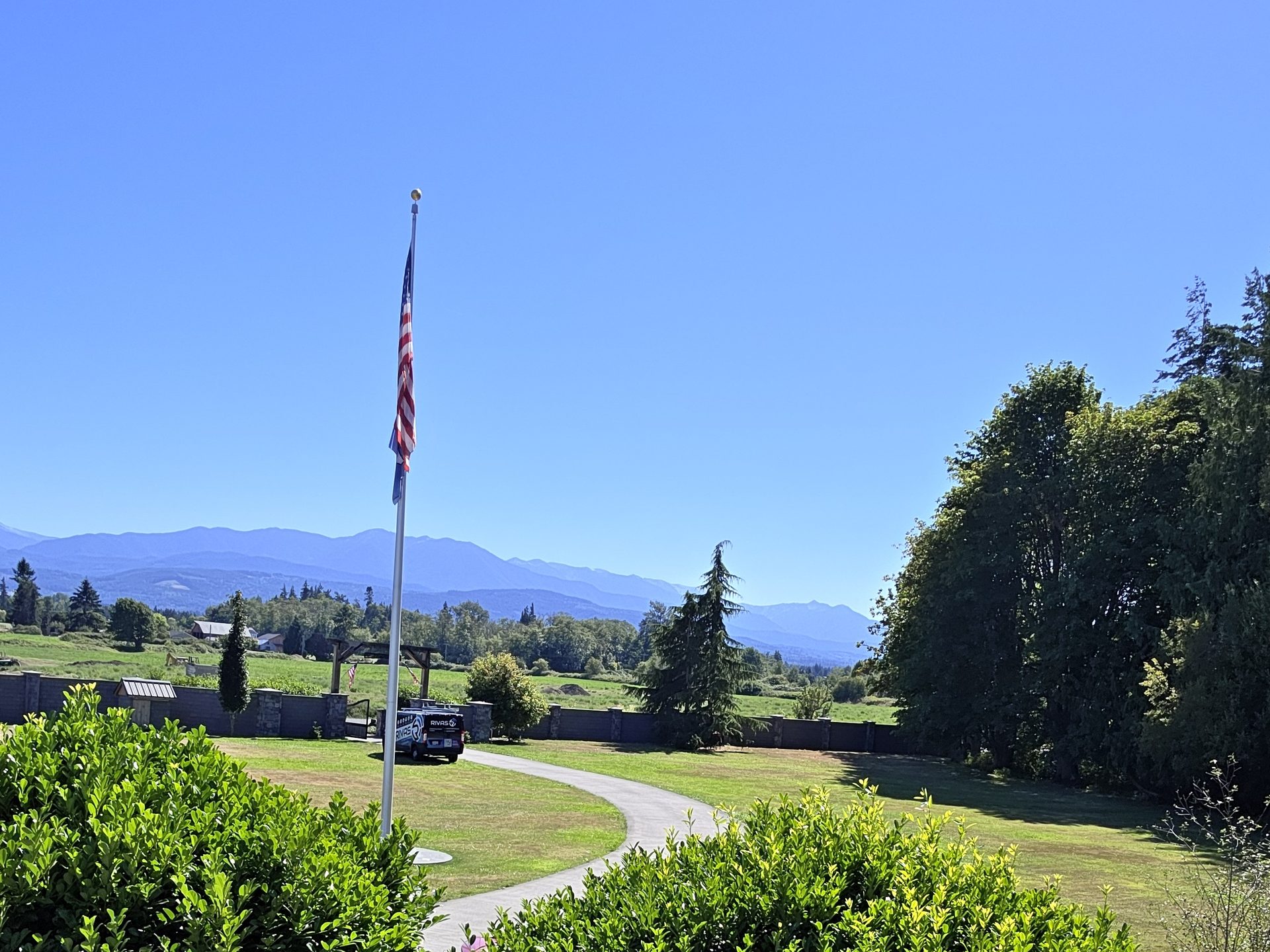The grounds of the Sequim property from the access point mount, with the Olympic Mountains beyond