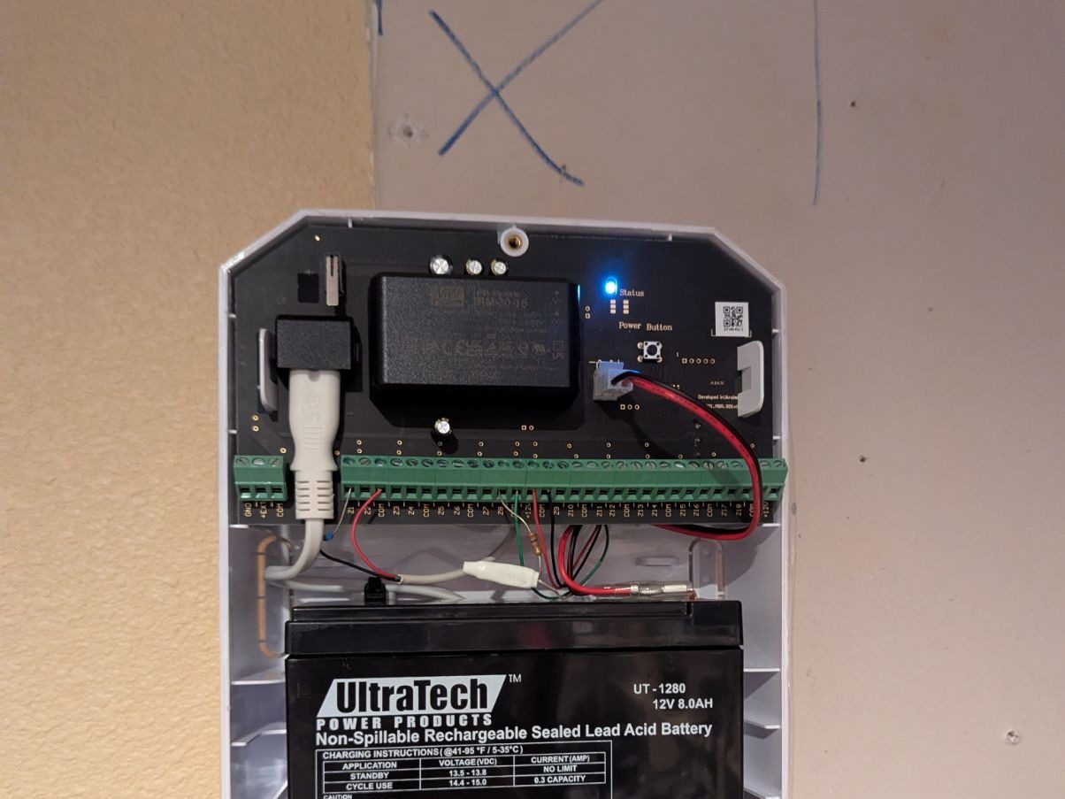 Inside the Ajax MultiTransmitter: the wired zones on terminal blocks and the backup battery